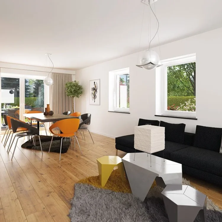 Moderner offener Wohnbereich mit schwarzem Sofa, Essbereich mit orangenen Stühlen und geometrischen Couchtischen