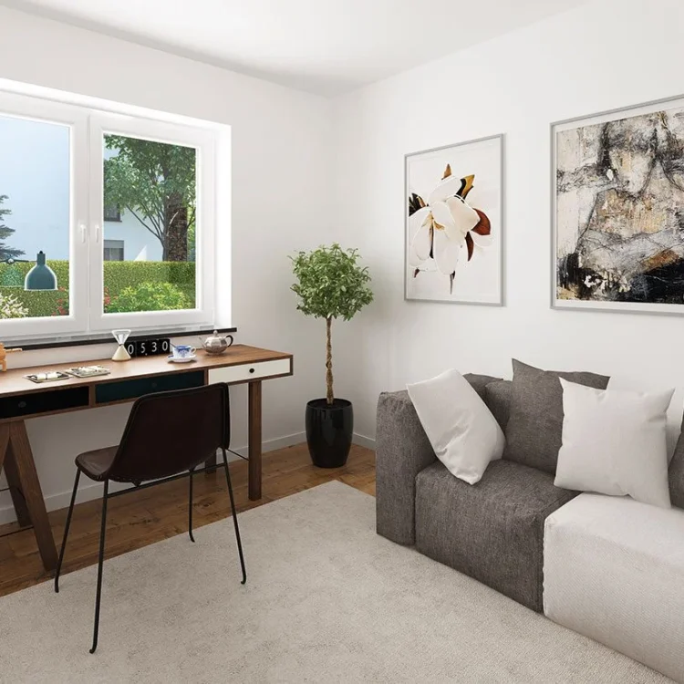 Modernes Gästezimmer mit grauem Sofa, Holzschreibtisch am Fenster und zwei gerahmten Kunstwerken an weißer Wand