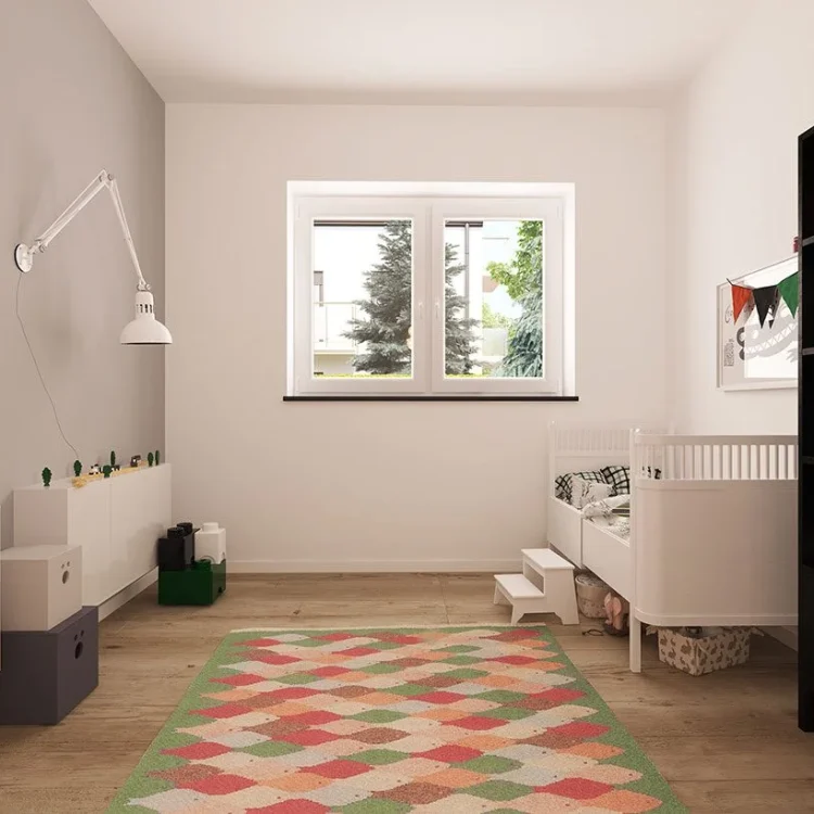 Modernes Kinderzimmer mit weißem Bett, buntem geometrischem Teppich, Schreibtisch und schwarzem Regal