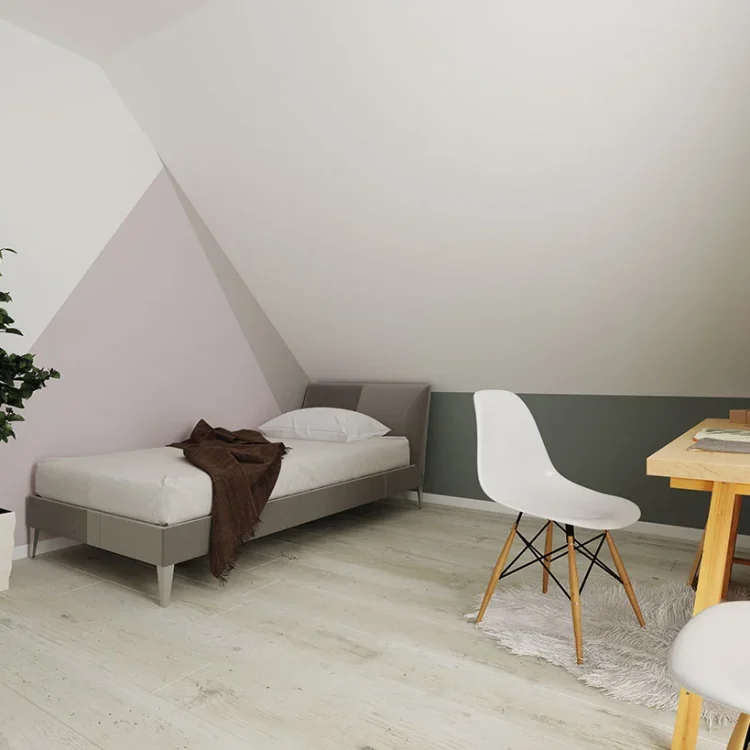 Modernes Kinderzimmer im Dachgeschoss mit grauem Bett, weißem Designer-Stuhl, Holzschreibtisch und Grünpflanze