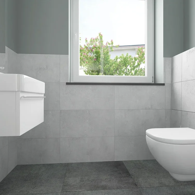Modernes Gäste-WC mit weißer Wandtoilette, Waschbecken und grauer Fliesenoptik im Doppelhaus DH 110
