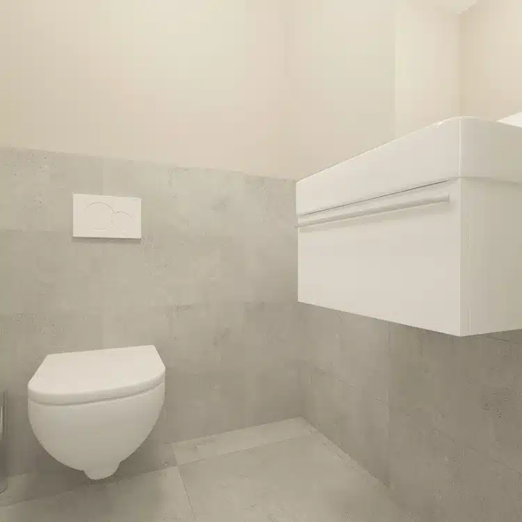 Modernes Gäste-WC mit wandhängender Toilette, weißem Waschtisch und grauen Betonoptik-Fliesen