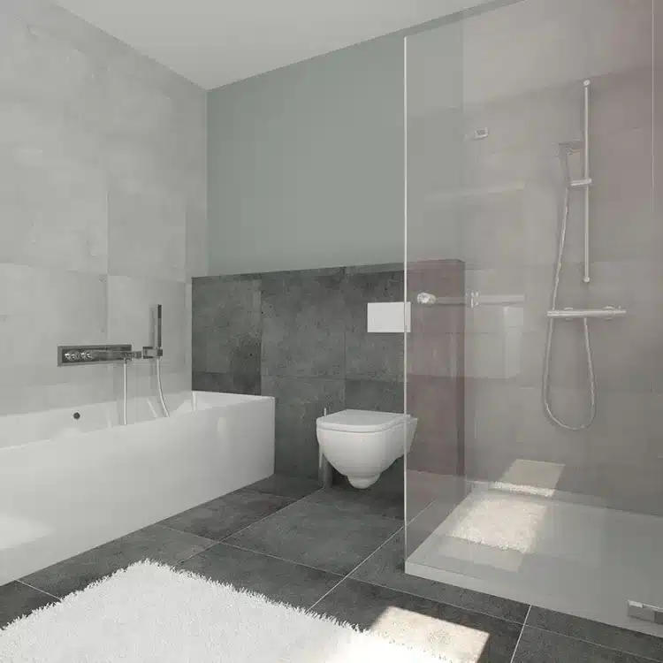 Modernes Badezimmer mit weißer Badewanne, wandhängendem WC, bodengleicher Dusche und anthrazitfarbenen Fliesen