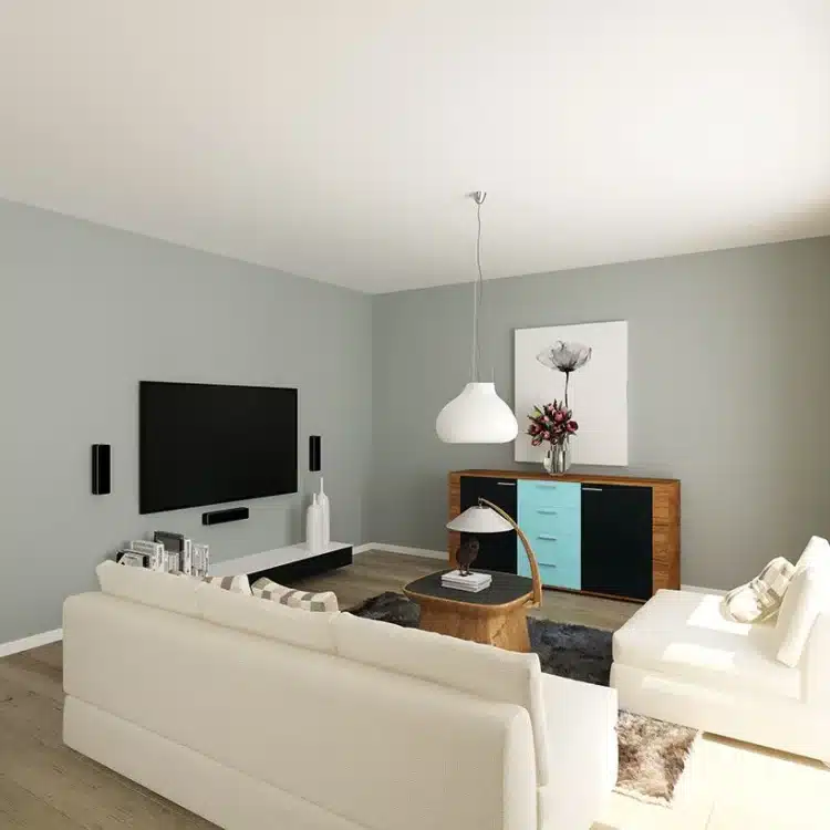 Modernes Wohnzimmer mit weißem Sofa, Wandfernseher und Sideboard in grau gestrichenen Räumen