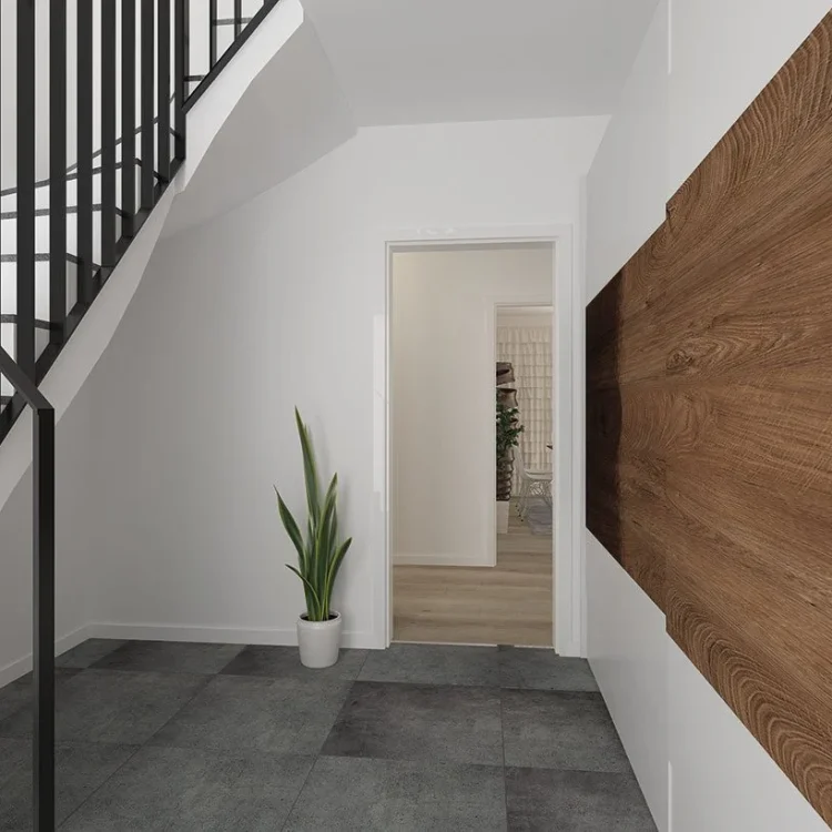 Modernes Treppenhaus mit schwarzem Metallgeländer, Holzwand und grauer Steinbodenfliesen in einem Zweifamilienhaus