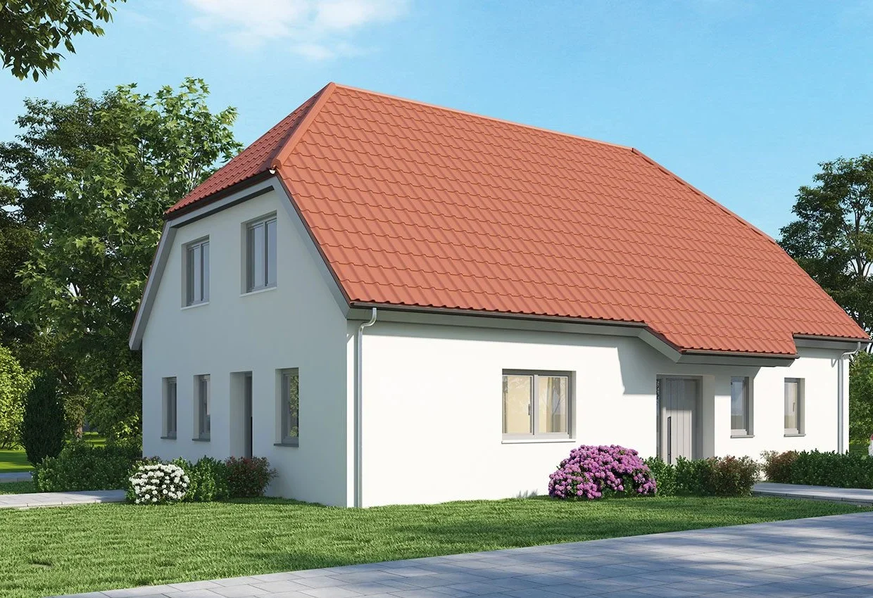 Zweifamilienhaus ZH 200 mit rotem Ziegeldach, weißer Fassade und grünem Garten vor blauem Himmel